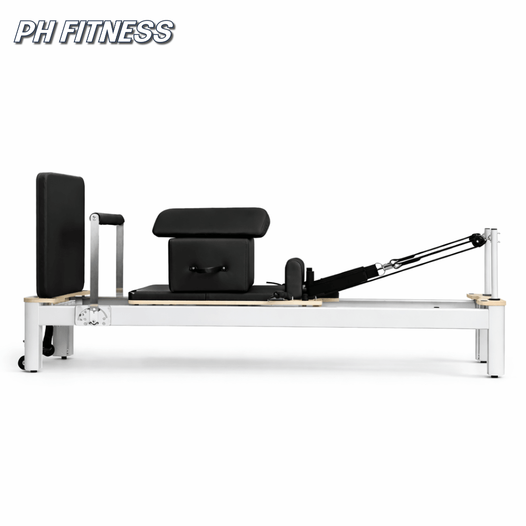 Vue latérale du Reformer Pilates PH Fitness en aluminium blanc