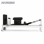 Vue latérale du Reformer Pilates PH Fitness en aluminium blanc