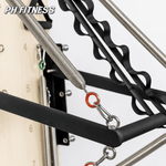 Détail des ressorts et de la barre push-through de l’appareil mural Pilates
